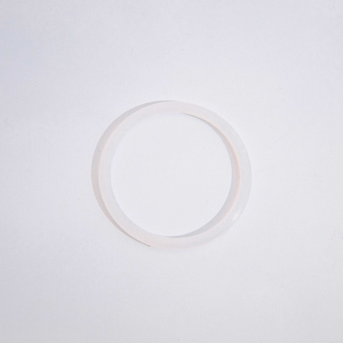 A clear circular silicone seal for a Twist & Lock Canister against a white background.