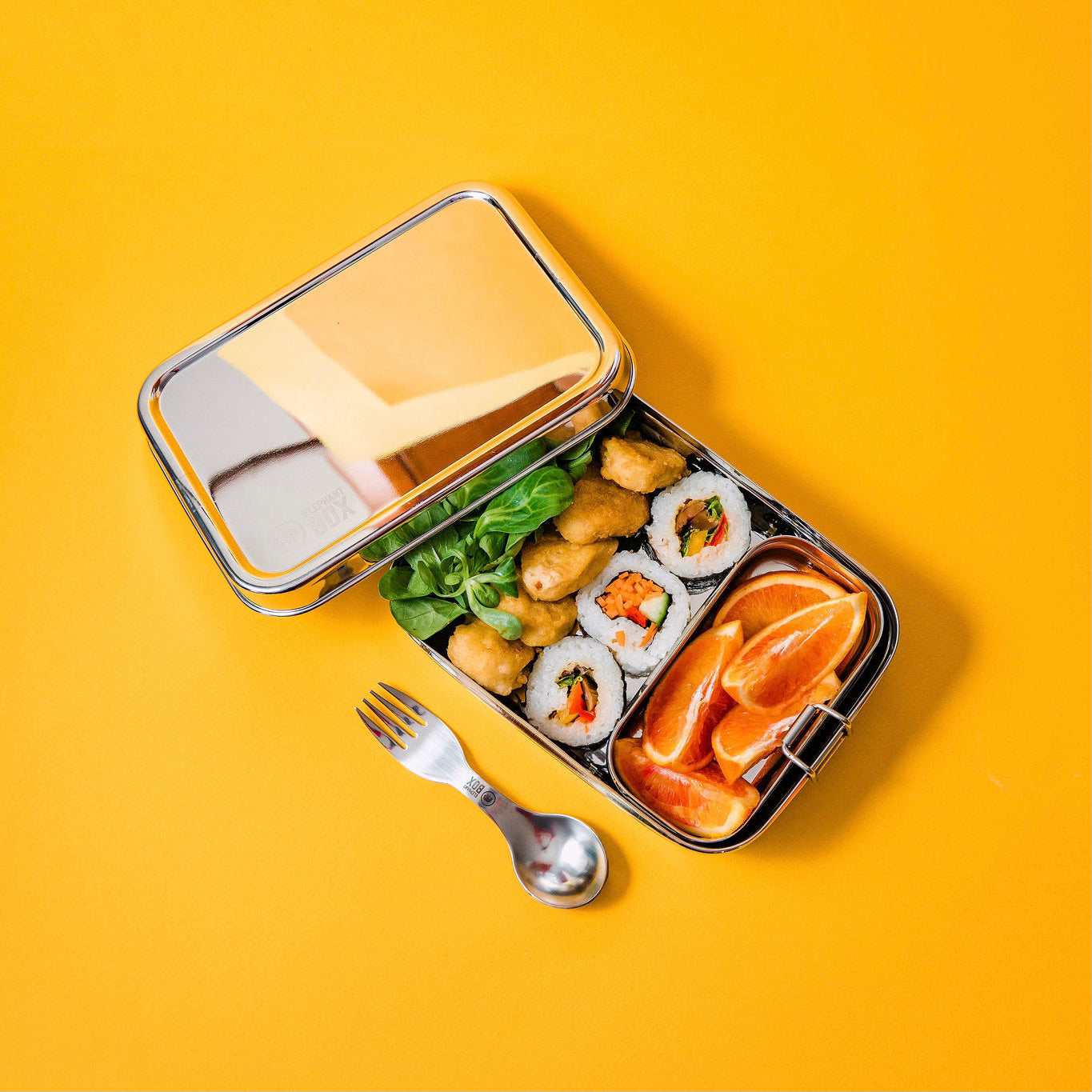 A stainless steel two-in-one lunchbox set with a larger box and a detachable smaller box inside, both with elephant box branding.