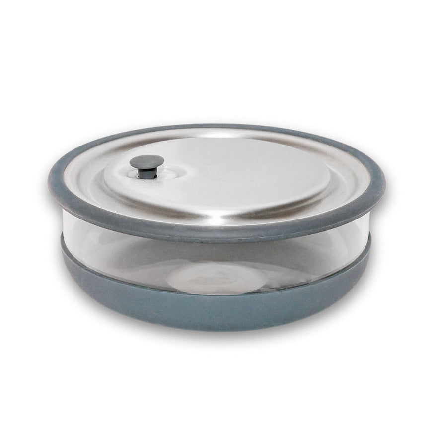 A medium-sized elephant box lunch bowl with a glass base and a grey silicone sleeve, featuring a stainless steel lid and a vacuum seal push down tab.