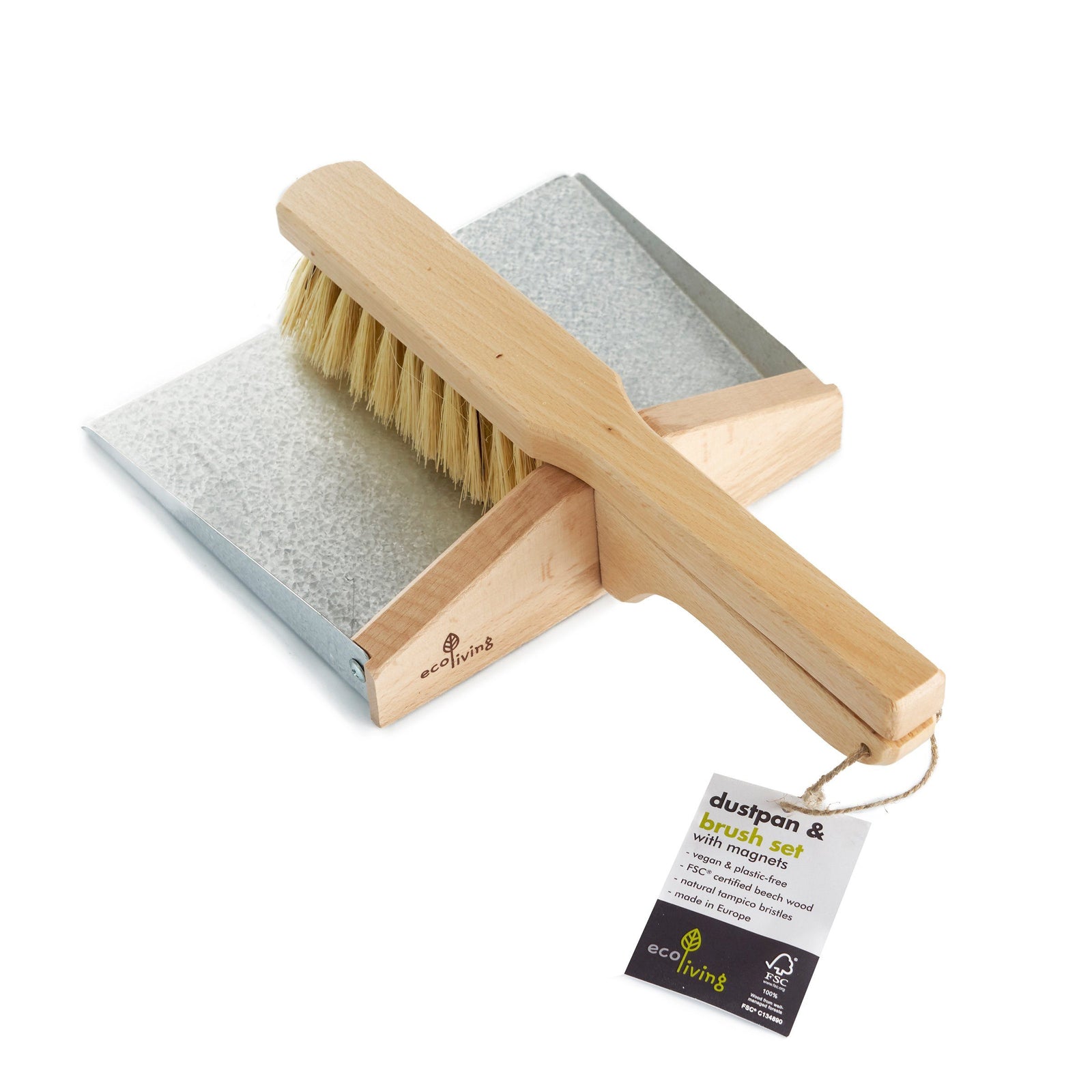 A metal dust pan with a wooden handle and a wooden brush with natural bristles, both with visible branding tags from Ecoliving