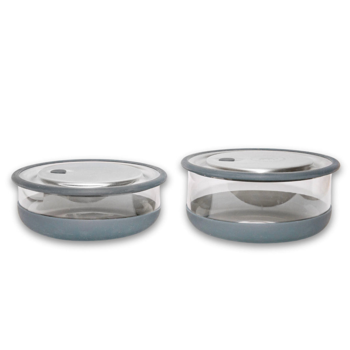 Two Elephant box lunch bowls with borosilicate glass bases and removable silicone sleeves and stainless steel lid.  in gray.  featuring a push down tab on the lid to createa airtight vacuum seal. The bowls are in two sizes: 800ml and 600ml. 