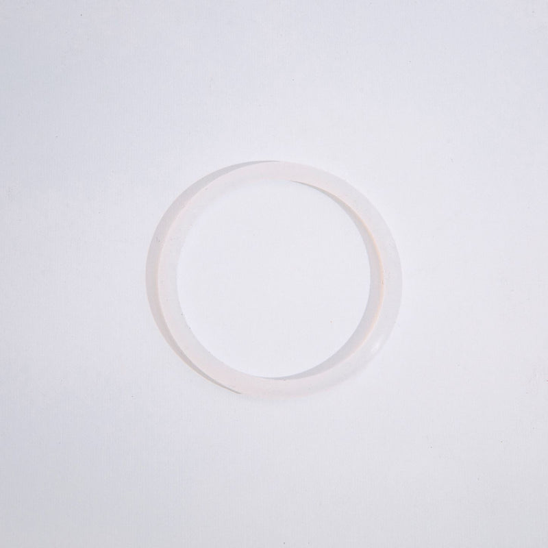 A single, clear, circular silicone seal for a steel cap intended for single wall bottles, displayed against a white background.