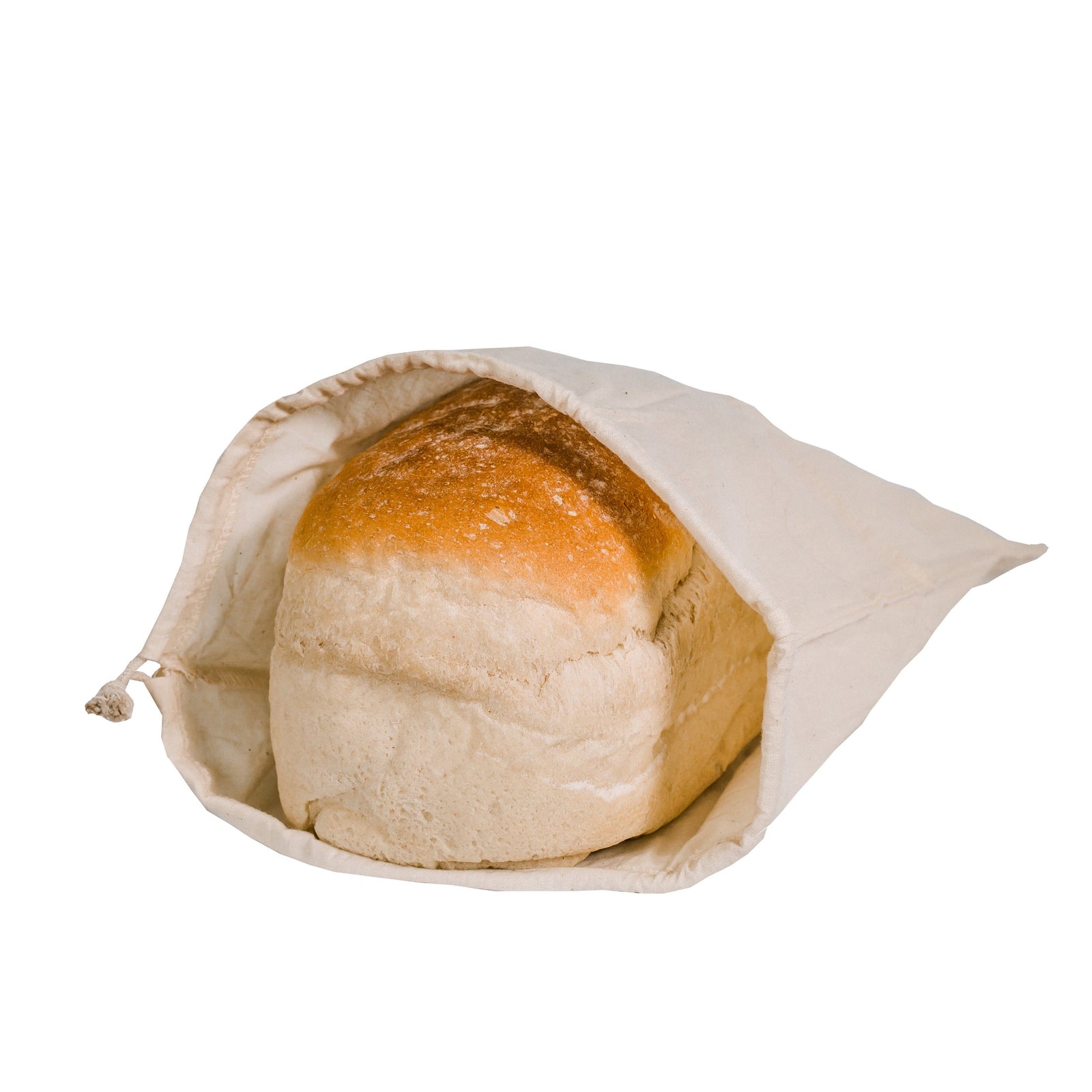A loaf of bread inside an organic cotton bread bag.